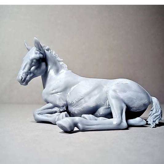 Hermes lying down (Suffolk Punch foal) by Animal den miniatures