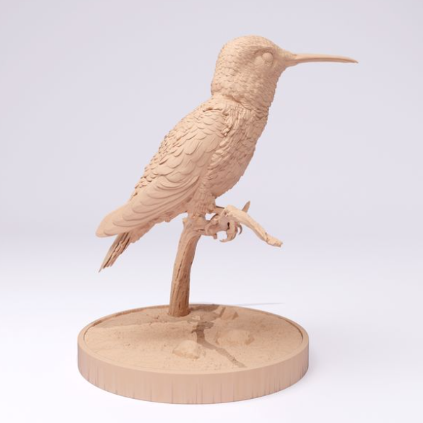 Un colibri est assis sur une branche de Animal miniatures comme impression 3D