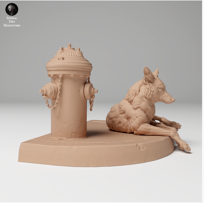 Coyote is lying in front of a hydrant from Animal den miniatures as 3D print
